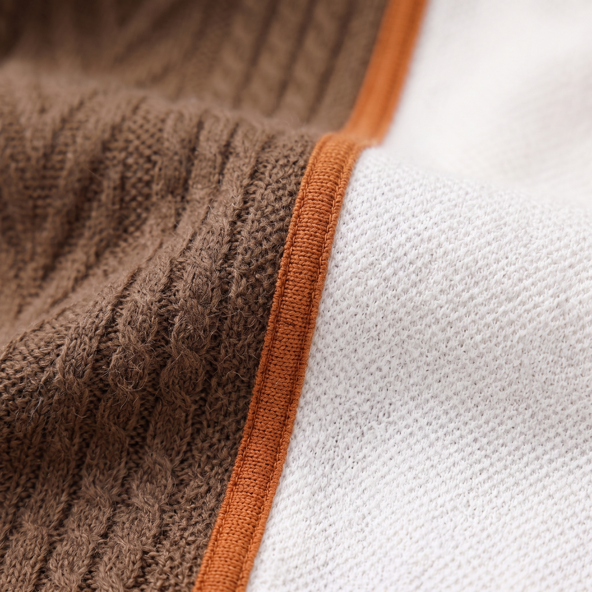 Dark brown contrast-color knit sweater, fabric close-up